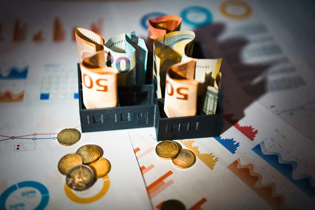 A pile of money sitting on top of a table