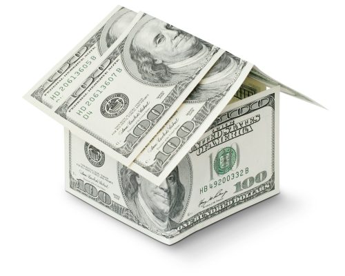 a house made out of money on a white background